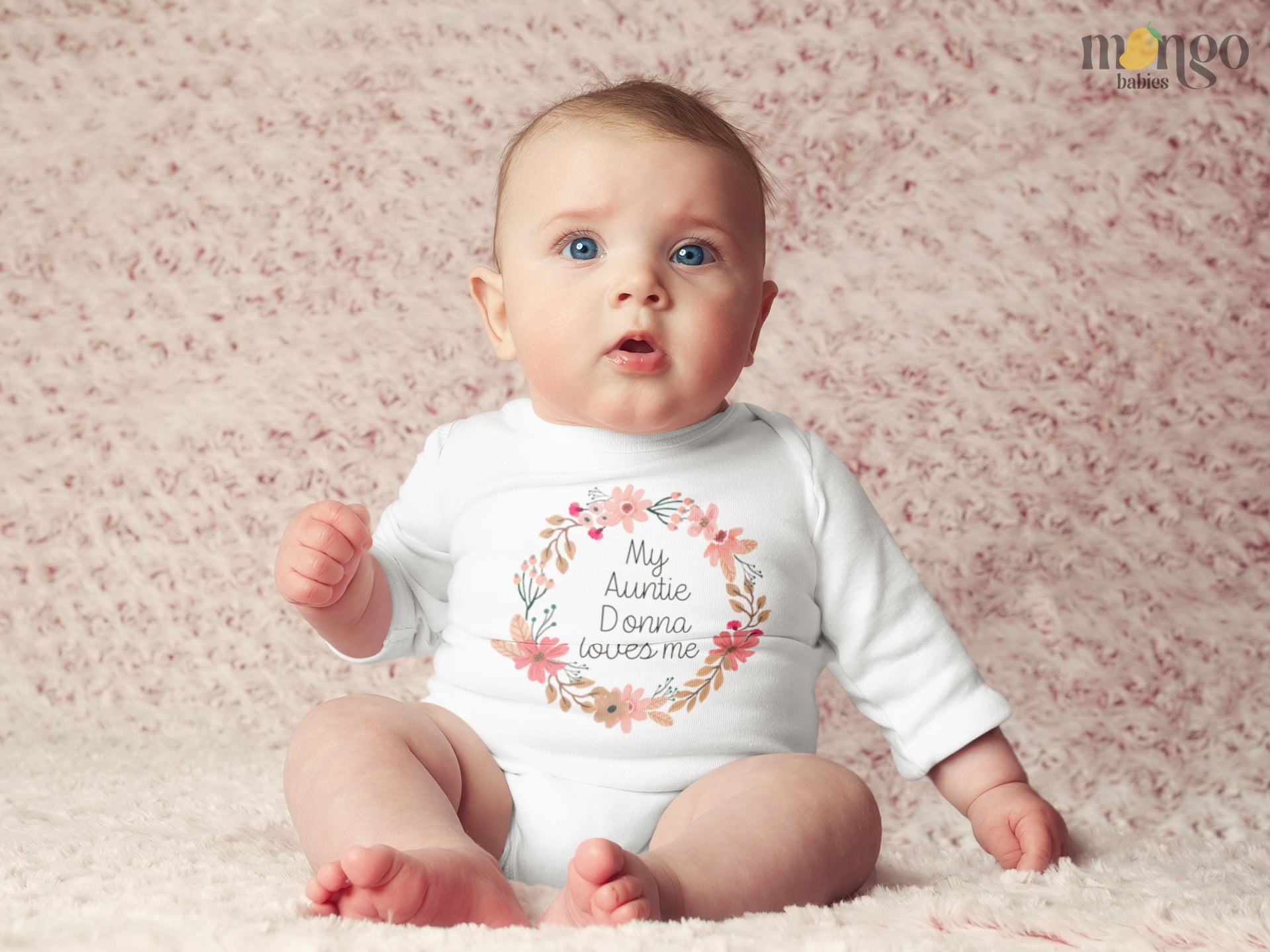 Long Sleeve Baby Bodysuit featuring a floral wreath design and customizable text 'My Auntie Loves Me.