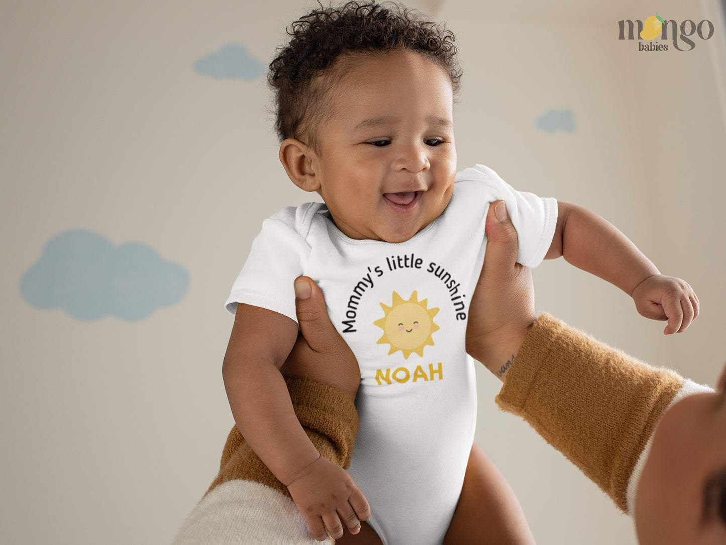 Baby Onesie with a cute sun graphic and text Mommy's Little Sunshine with custom name - made from high quality fabric and safe ink print 