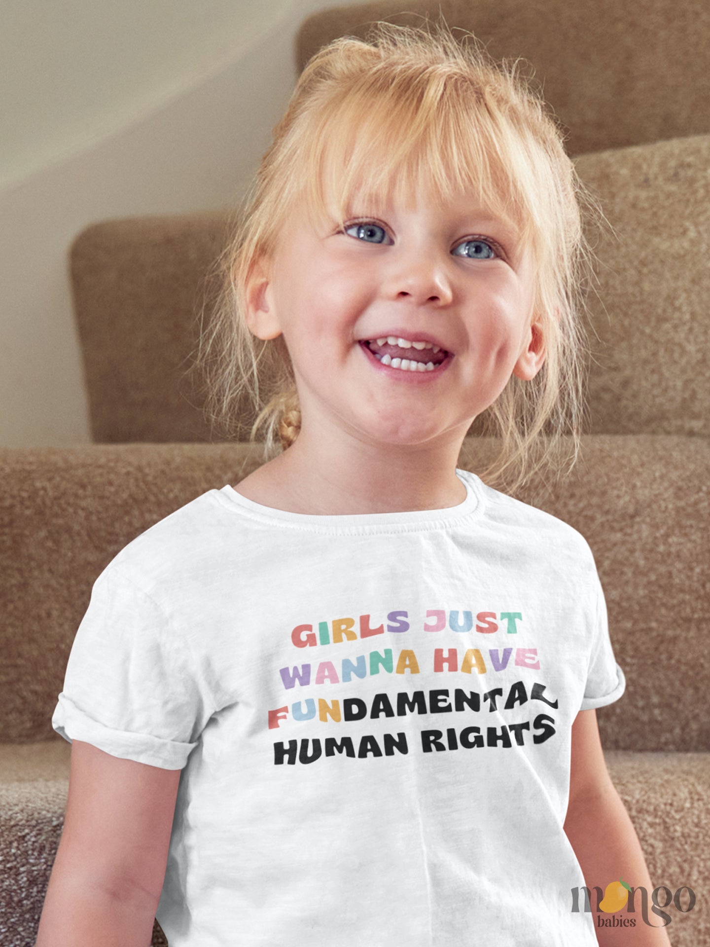 Kid's t-shirt featuring a fun printed graphic and the empowering text 'Girls Just Wanna Have Fundamental Human Rights.' Explore this inspiring tee that encourages equality and empowerment.
