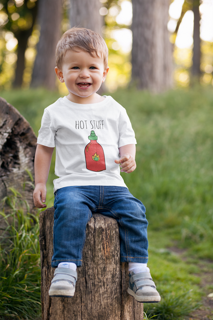 Kid's t-shirt showcasing an adorable printed graphic of a chili bottle and the bold text 'Hot Stuff.' Elevate your child's style with this trendy and playful tee. 