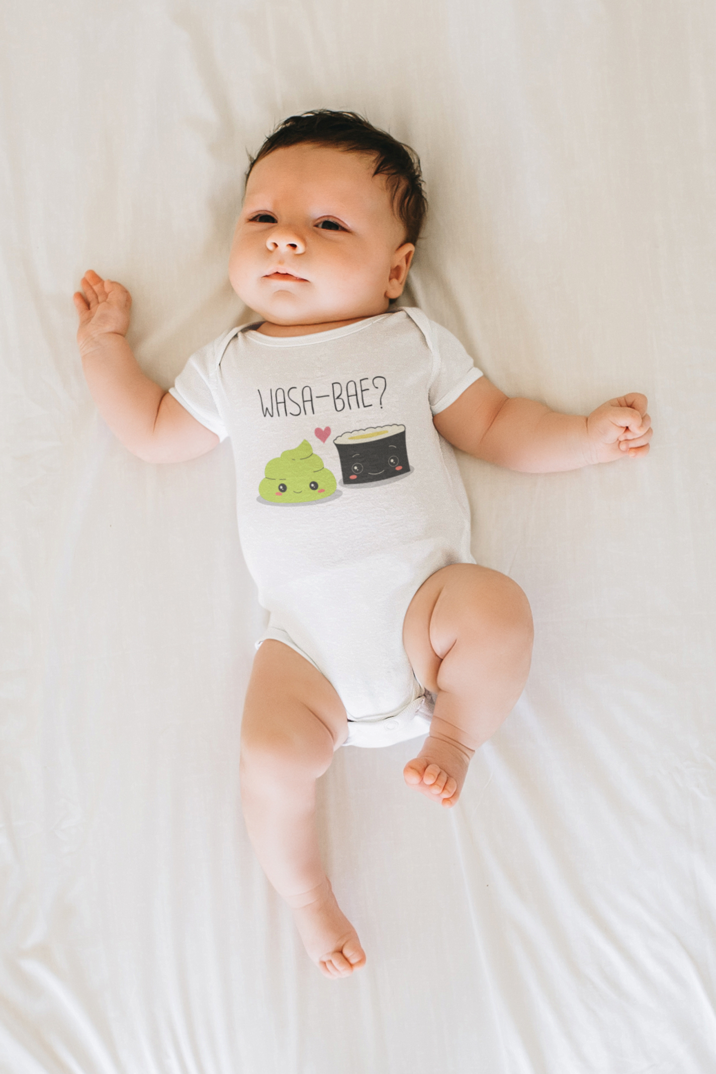 Baby bodysuit showcasing a cute printed graphic of a sushi and wasabi, along with the playful text 'Wasa-Bae.' Explore this delightful tee that adds a touch of trendy and fun style to your child's wardrobe. 