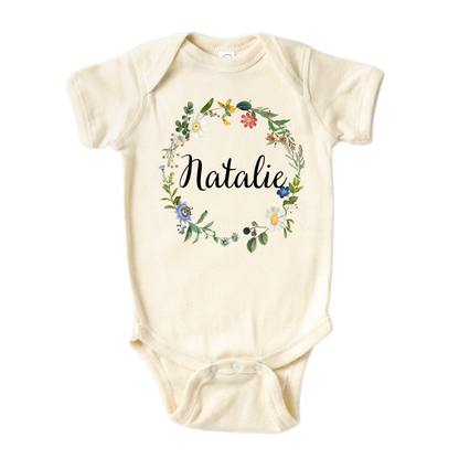 Baby Onsie with cute floral wreath design and customizable text 'Name'.