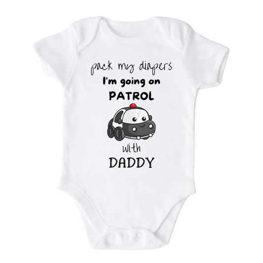 White Onesie with a cute printed graphic of a police car and the text 'Pack My Diapers I'm Going On Patrol with Daddy.' This adorable t-shirt is perfect for little ones who admire their police officer dads and enjoy exciting adventures. Made with high-quality materials, it offers comfort and durability, making it a great addition to any child's wardrobe.