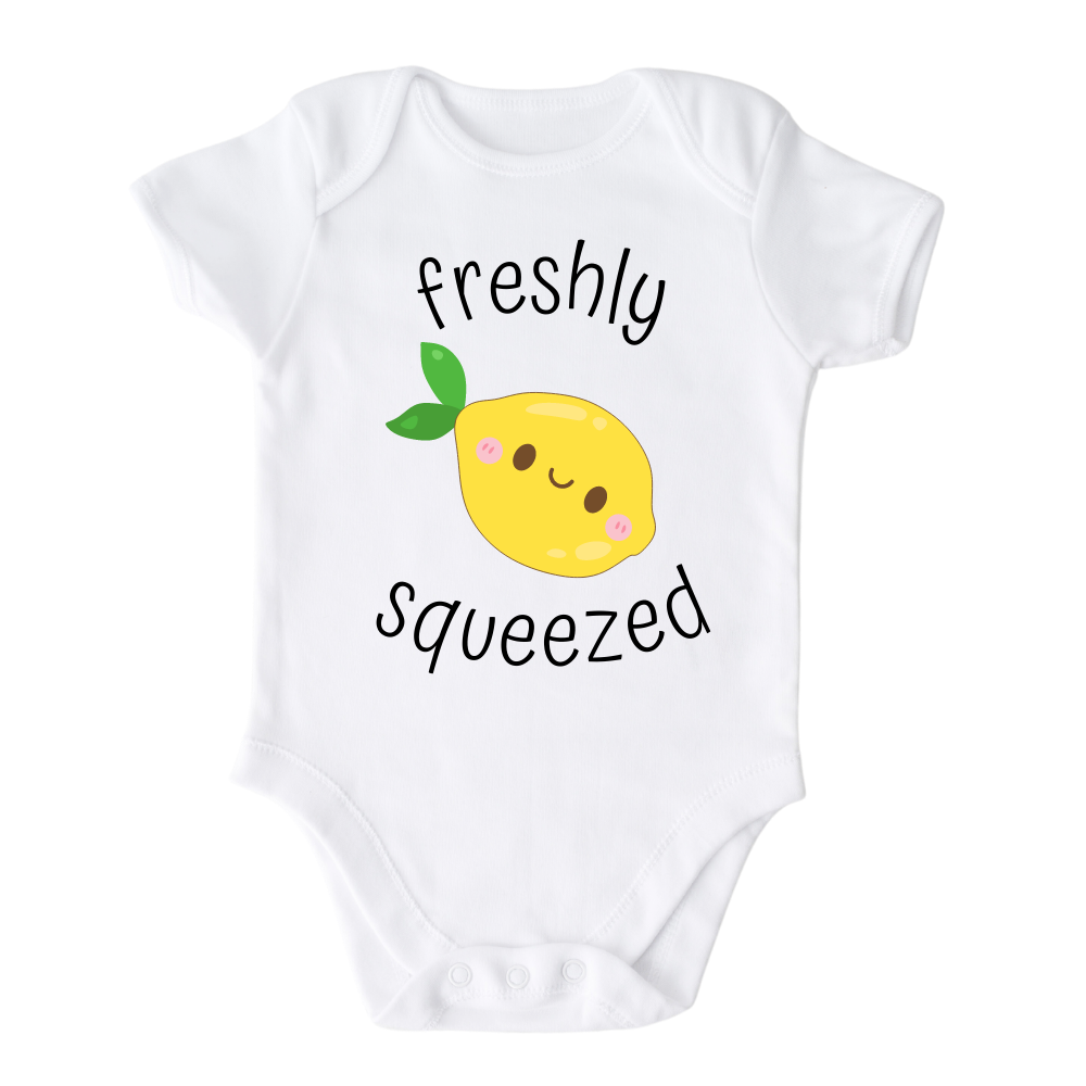 A kids' t-shirt with an adorable graphic of a cute lemon and the text 'Freshly Squeezed.' This design captures the refreshing and playful nature of the citrus fruit, adding a vibrant touch to the wearer's style. It's a delightful and eye-catching tee that stands out with its zestful charm.