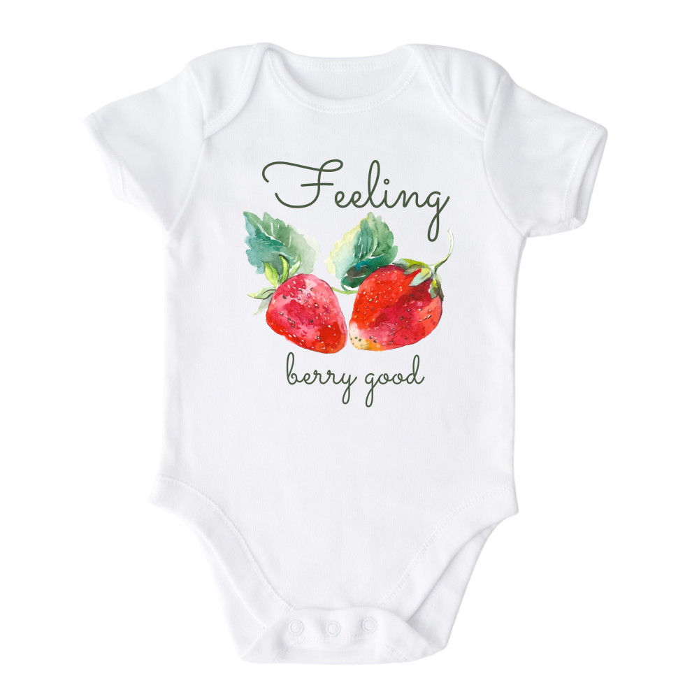 White Bodysuit featuring a cute strawberry graphic and the text 'Berry Good.' Add a playful charm to your child's style with this delightful tee