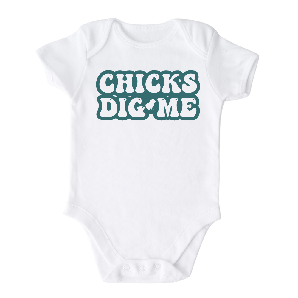 White Onesie featuring a cute and eye-catching printed graphic of bold green text saying 'Chicks Dig Me.' Embrace your child's charm and confidence with this playful tee.