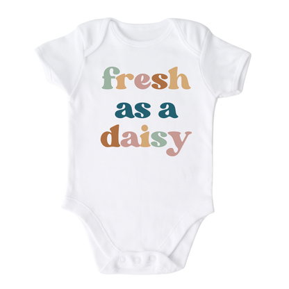 White Bodysuit with a colorful graphic of the text 'Fresh as a daisy.' This vibrant design adds a cheerful and trendy touch to your child's outfit.