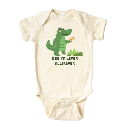 Natural Baby Onesie showcasing a playful printed graphic of an alligator and the text 'See Ya Later Alligator.' Explore this delightful tee that adds a touch of whimsy and charm to your child's wardrobe.