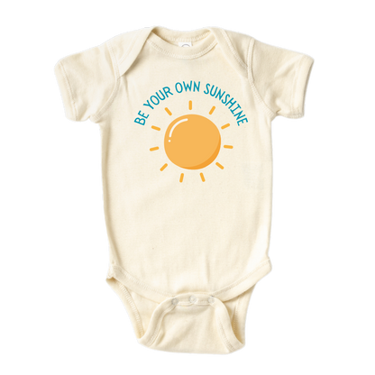 Natural Baby Onesie featuring an adorable printed graphic of a sun with the empowering text 'Be Your Own Sunshine.' Encourage positivity and self-confidence with this delightful tee. 