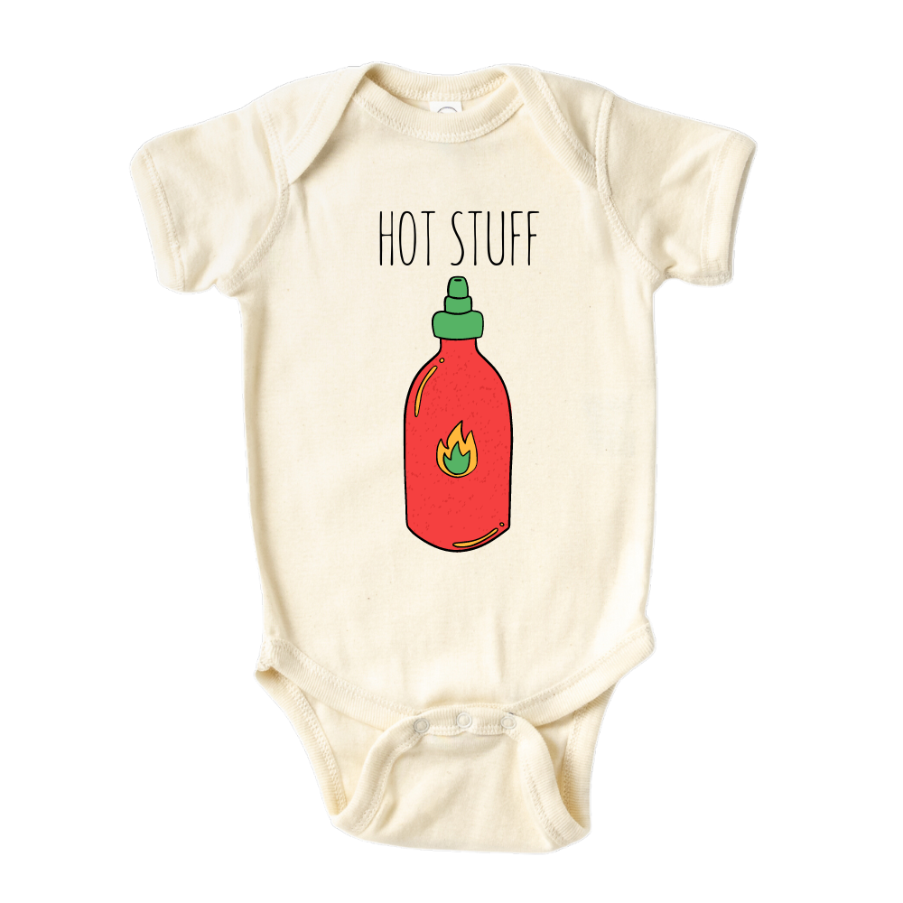 Natural Onesie showcasing an adorable printed graphic of a chili bottle and the bold text 'Hot Stuff.' Elevate your child's style with this trendy and playful tee. 