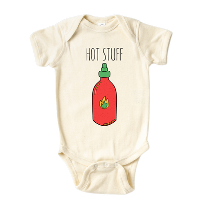 Natural Onesie showcasing an adorable printed graphic of a chili bottle and the bold text 'Hot Stuff.' Elevate your child's style with this trendy and playful tee. 