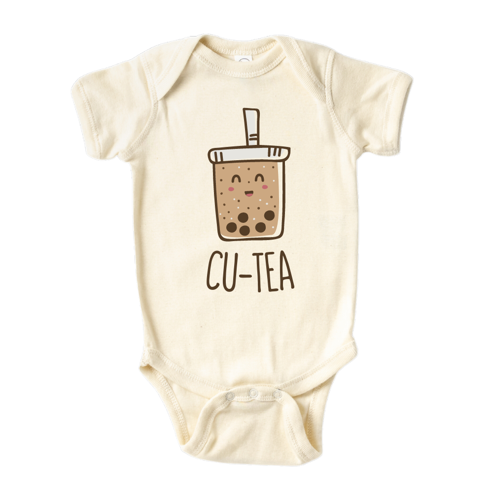A kids' t-shirt with a charming graphic of a boba cup and the text 'Cu-tea.' The design captures the whimsical appeal of the popular tea drink and showcases the wearer's fondness for cuteness and trendy fashion.