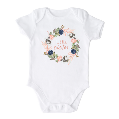 White Baby Bodysuit Onsie with a cute printed graphic of a floral wreath and the text 'Little Sister.' This adorable t-shirt celebrates the arrival of a precious little sister.