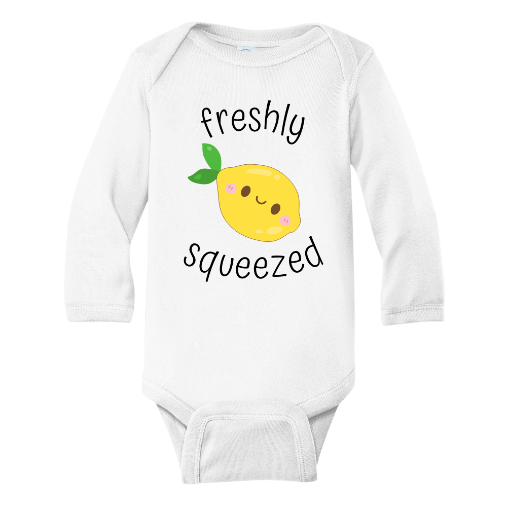 A kids' t-shirt with an adorable graphic of a cute lemon and the text 'Freshly Squeezed.' This design captures the refreshing and playful nature of the citrus fruit, adding a vibrant touch to the wearer's style. It's a delightful and eye-catching tee that stands out with its zestful charm.