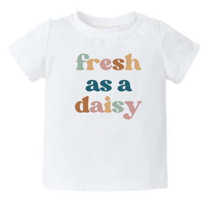 White kids' t-shirt with a colorful graphic of the text 'Fresh as a daisy.' This vibrant design adds a cheerful and trendy touch to your child's outfit.