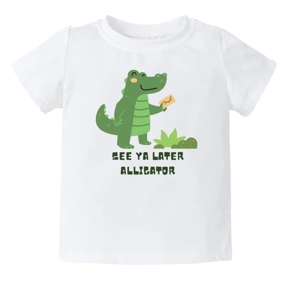 Kid's t-shirt showcasing a playful printed graphic of an alligator and the text 'See Ya Later Alligator.' Explore this delightful tee that adds a touch of whimsy and charm to your child's wardrobe.