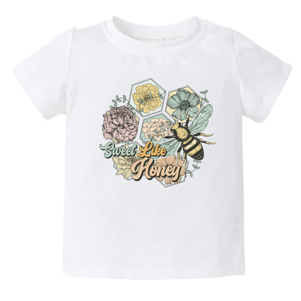 Kids' t-shirt with a cute retro graphic of flowers and bees, and the text 'Sweet Like Honey.' Trendy and playful design for stylish outfits. 