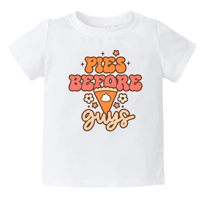 A kids' t-shirt with an adorable graphic of a cute pumpkin pie and the text 'Pie before guys.' The design represents a playful and confident attitude, celebrating the love for desserts and individuality. It's a fun and fashionable tee that showcases the wearer's unique style and personality.