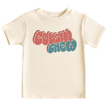 Natural Tshirt for Kid with a groovy printed graphic and the text 'Cousin Crew.' This trendy and cool design celebrates the bond of cousins in a unique and stylish way. 