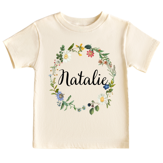Kid Tshirt with cute floral wreath design and customizable text 'Name'.