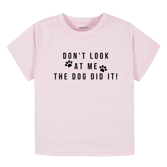 Image of baby onesie and children's t-shirt with the playful text 'The Dog Did It.' Adorable and humorous apparel for kids, perfect for playdates and family outings