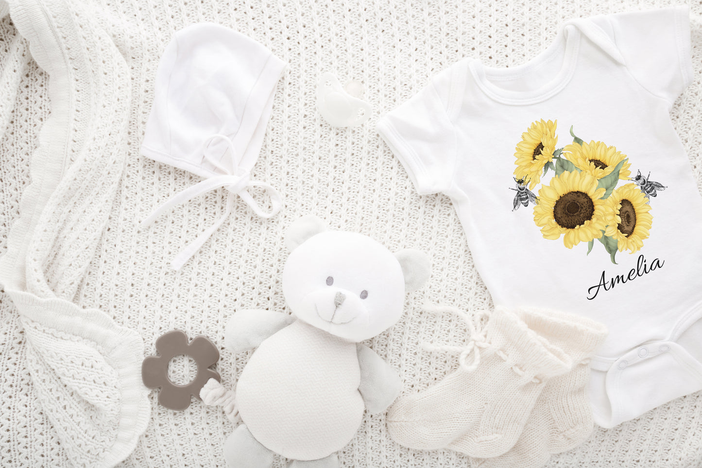 Baby Clothes A kid's t-shirt with a cute printed graphic of sunflowers and bees, personalized with a customized name. This delightful tee is stylish, comfortable, and made from high-quality materials. 