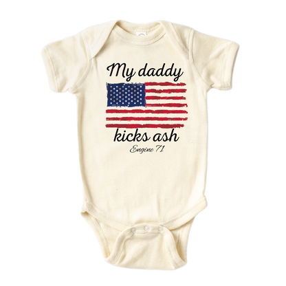 Natural Onesie with a cute printed design of American flag theme, customizable with the text 'My Daddy Kicks Assh'.