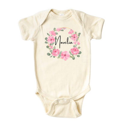 Kid's t-shirt with a cute pink floral wreath design, customizable with names.