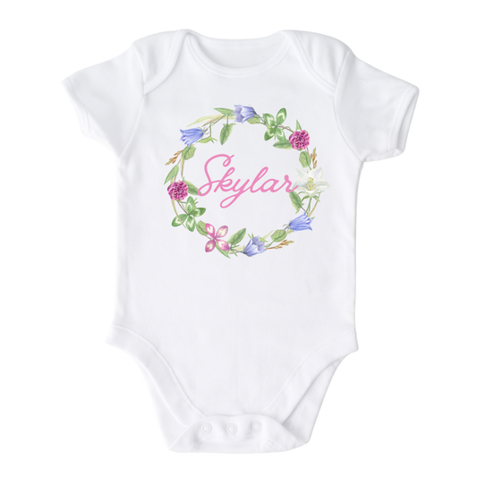 Kid's t-shirt with a cute floral wreath design, customizable with names.