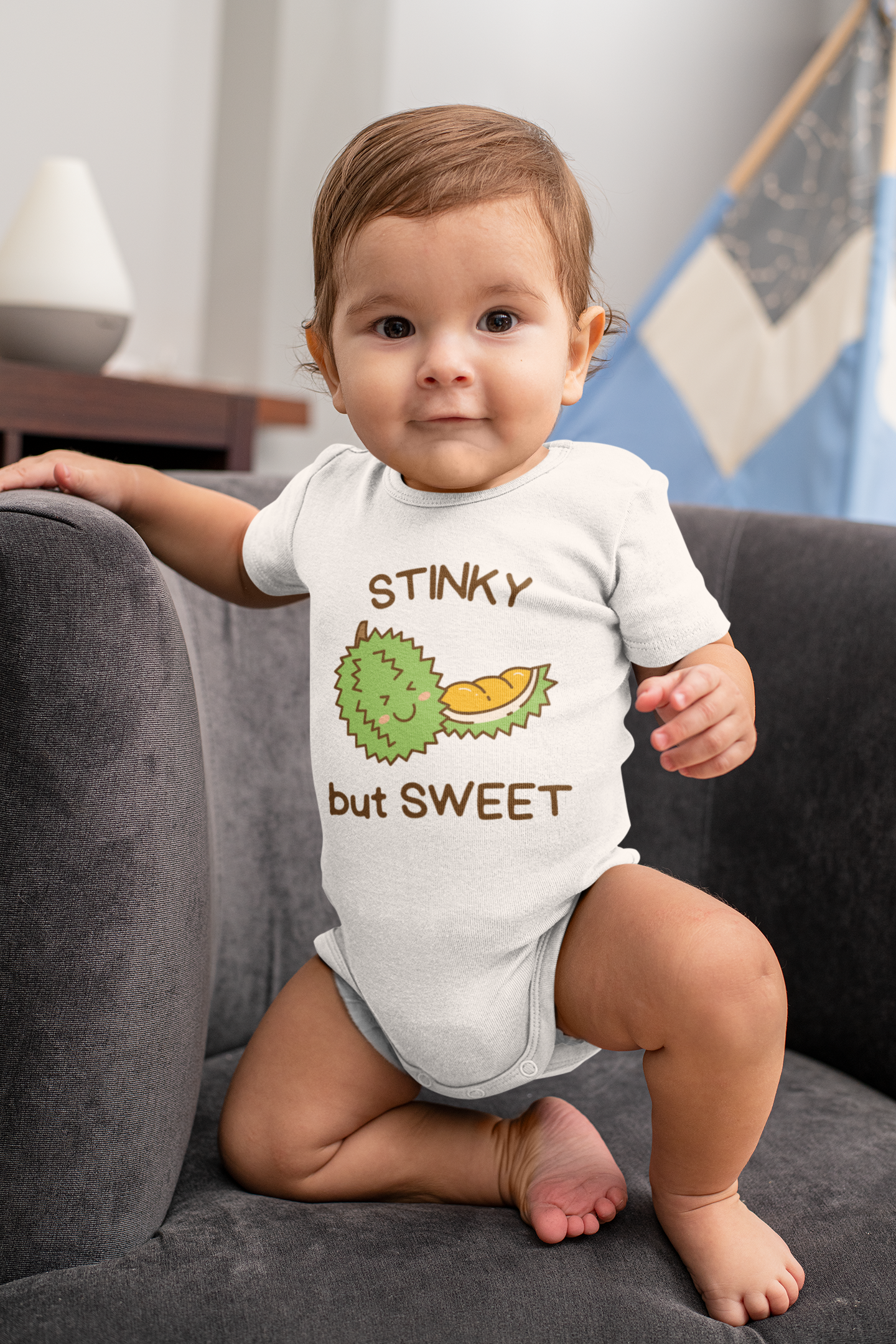 Baby Bodysuit with cute durian graphic and text 'Stinky but sweet.' Unique and funny design for children. 