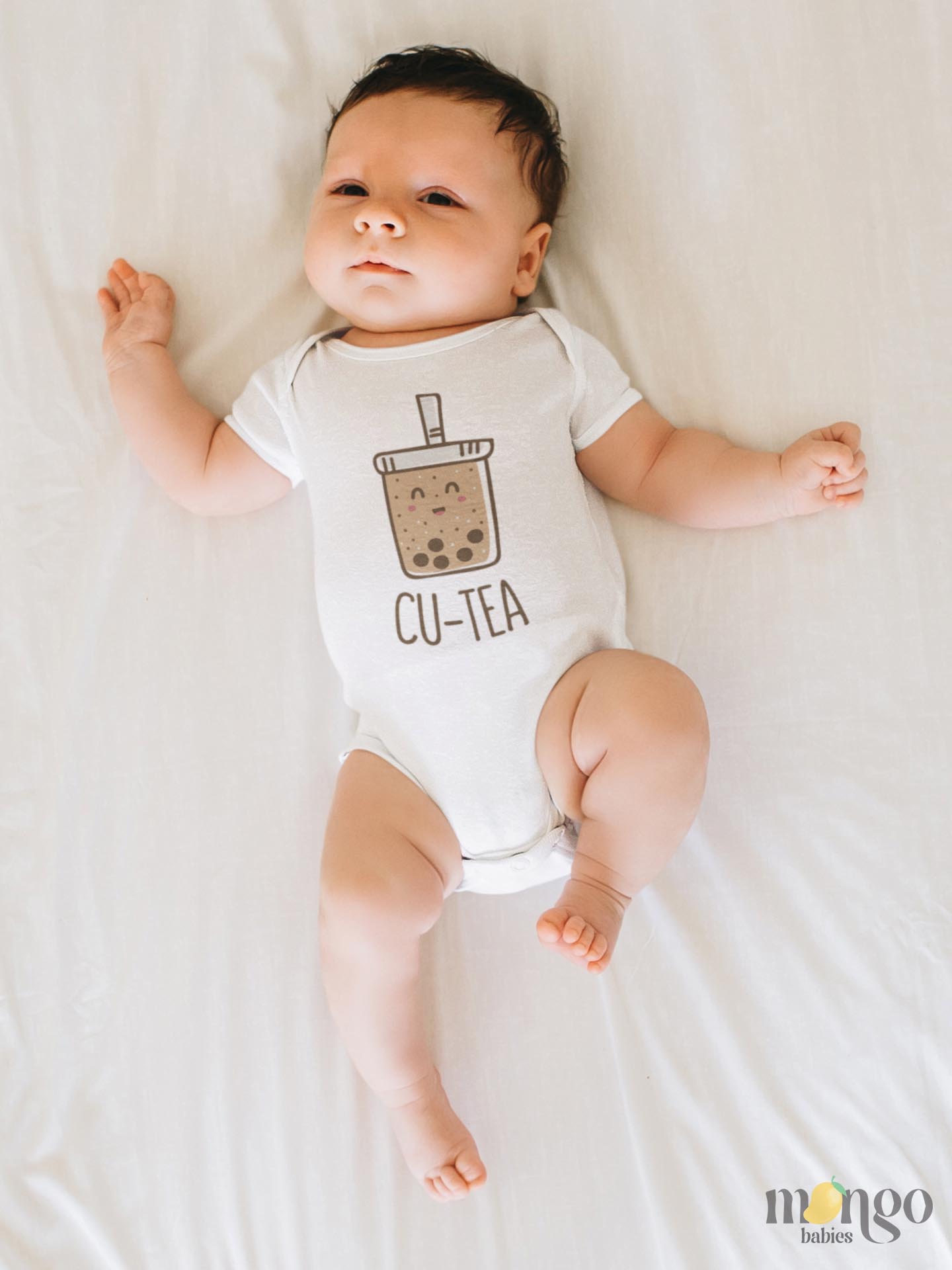 A kids' t-shirt with a charming graphic of a boba cup and the text 'Cu-tea.' The design captures the whimsical appeal of the popular tea drink and showcases the wearer's fondness for cuteness and trendy fashion.